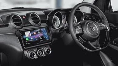 Car interior with Pioneer DMH-AP6650BT infotainment receiver integrated into dashboard console.